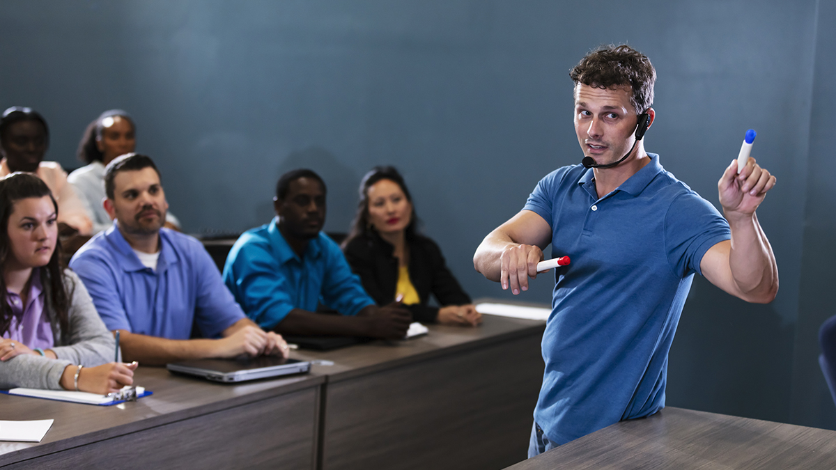 Mature man giving presentation