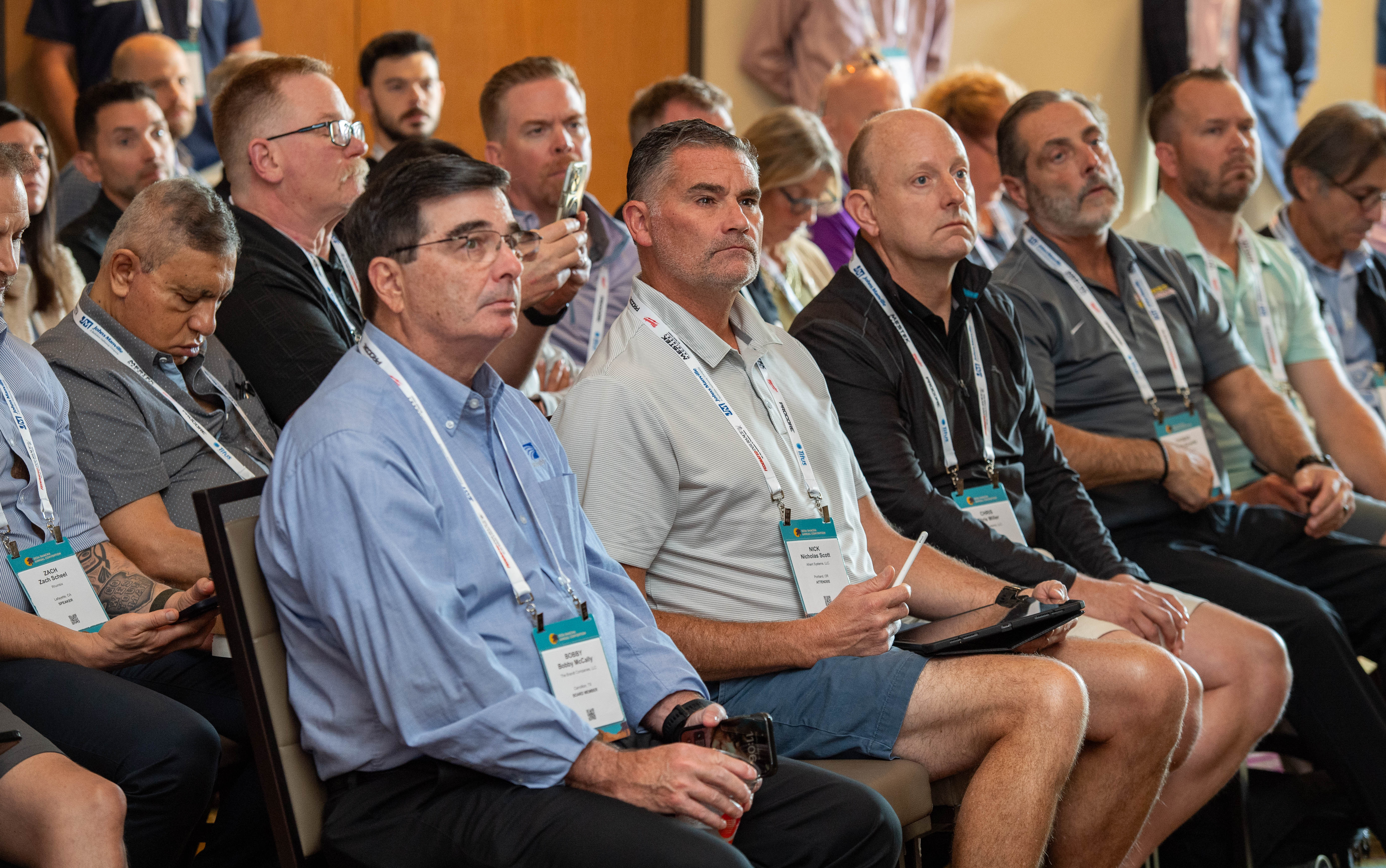 Seated committee members at a conference