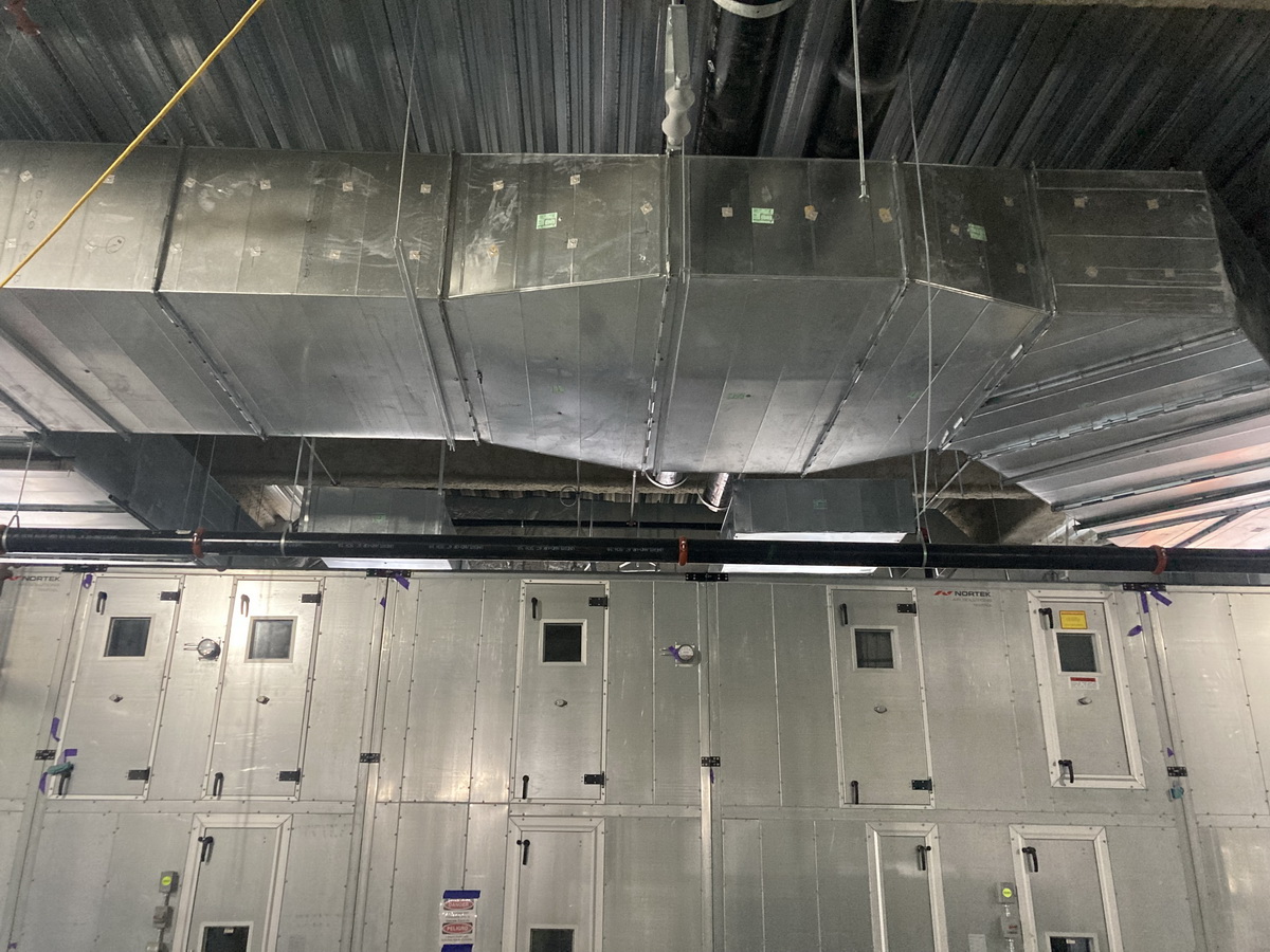 This level three mechanical room duct serves operating rooms on the second floor.